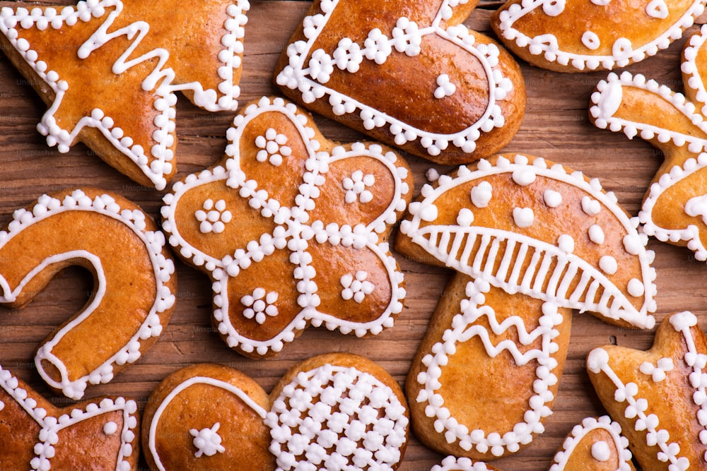 Christmas composition with gingerbreads. Studio shot on wooden background.