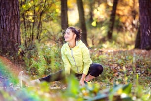 Young woman running outside in sunny nature