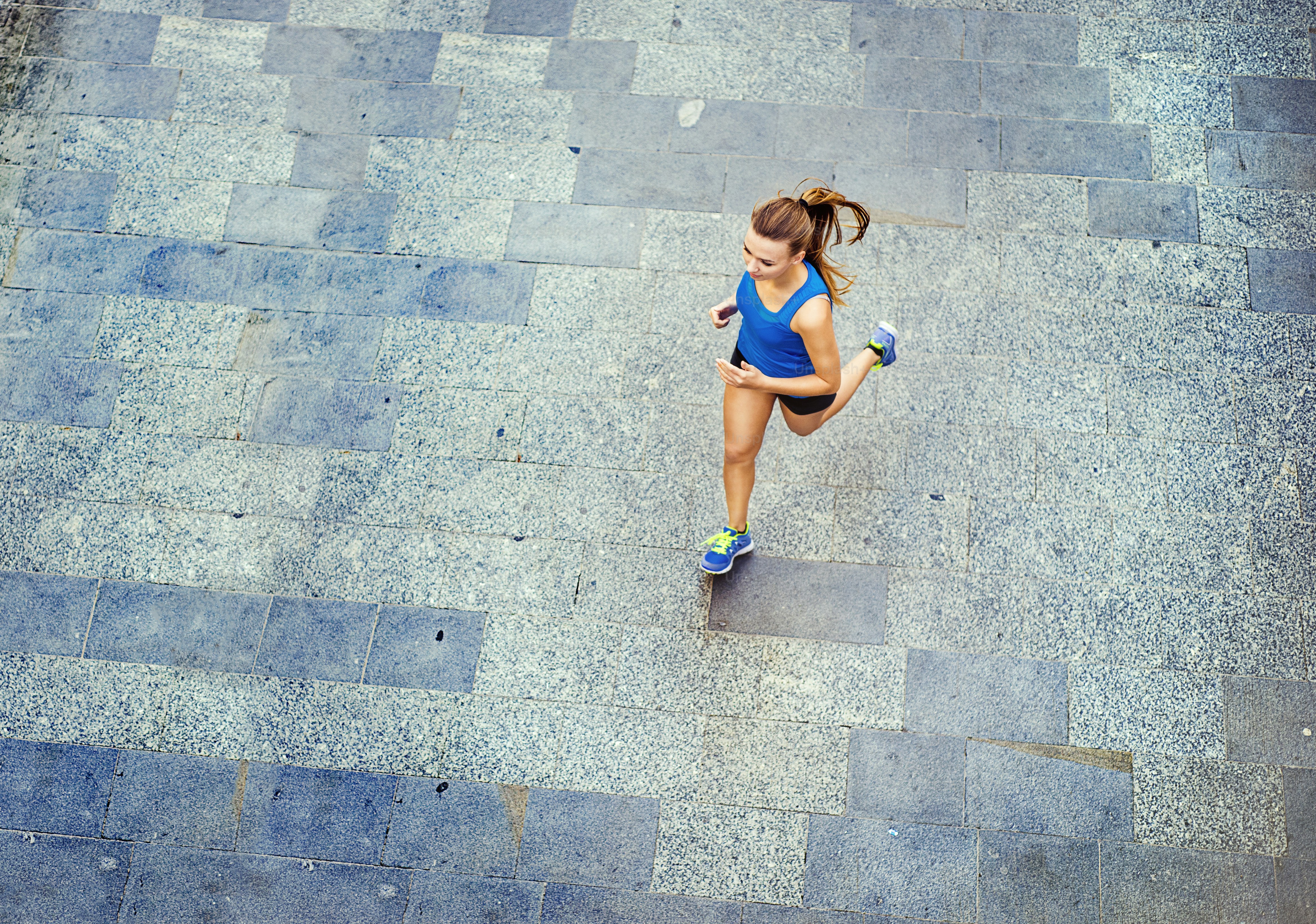 Runner stretching before training to avoid common marathon injuries in NYC