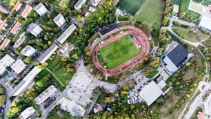 Aerial view of football stadium, apartment buildings and streets in town, Banska Bystrica, Slovakia.