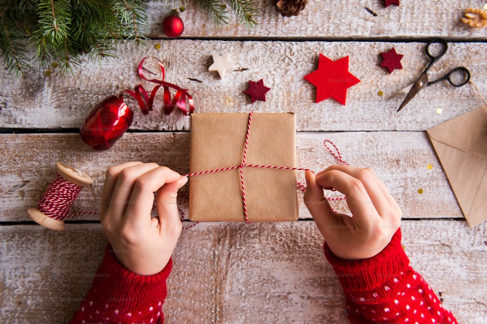this is  a picture of someone preparing a gift by wrapping it