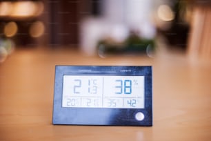 A meteostation on the table. Smart home control system.A meteostation on the wall. Smart home control system.