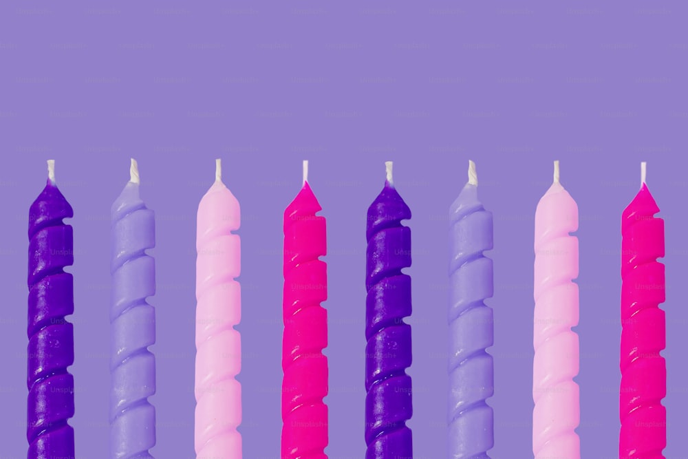 a row of candles sitting next to each other