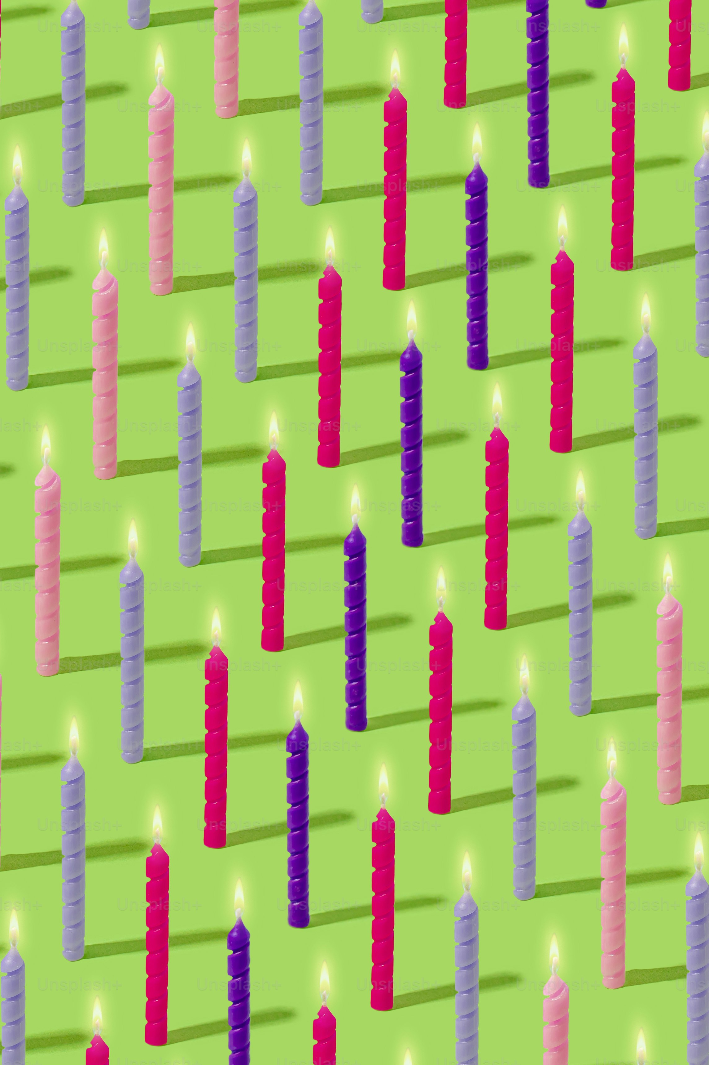 A group of lit candles sitting