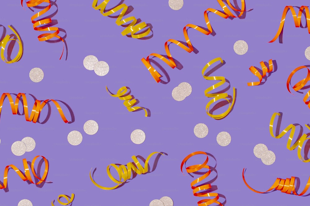 a purple background with orange ribbons and white dots