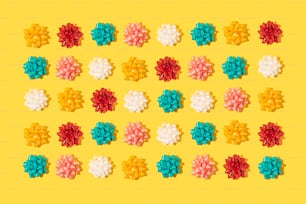 a yellow background with a bunch of different colored flowers