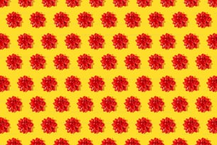 a pattern of red flowers on a yellow background