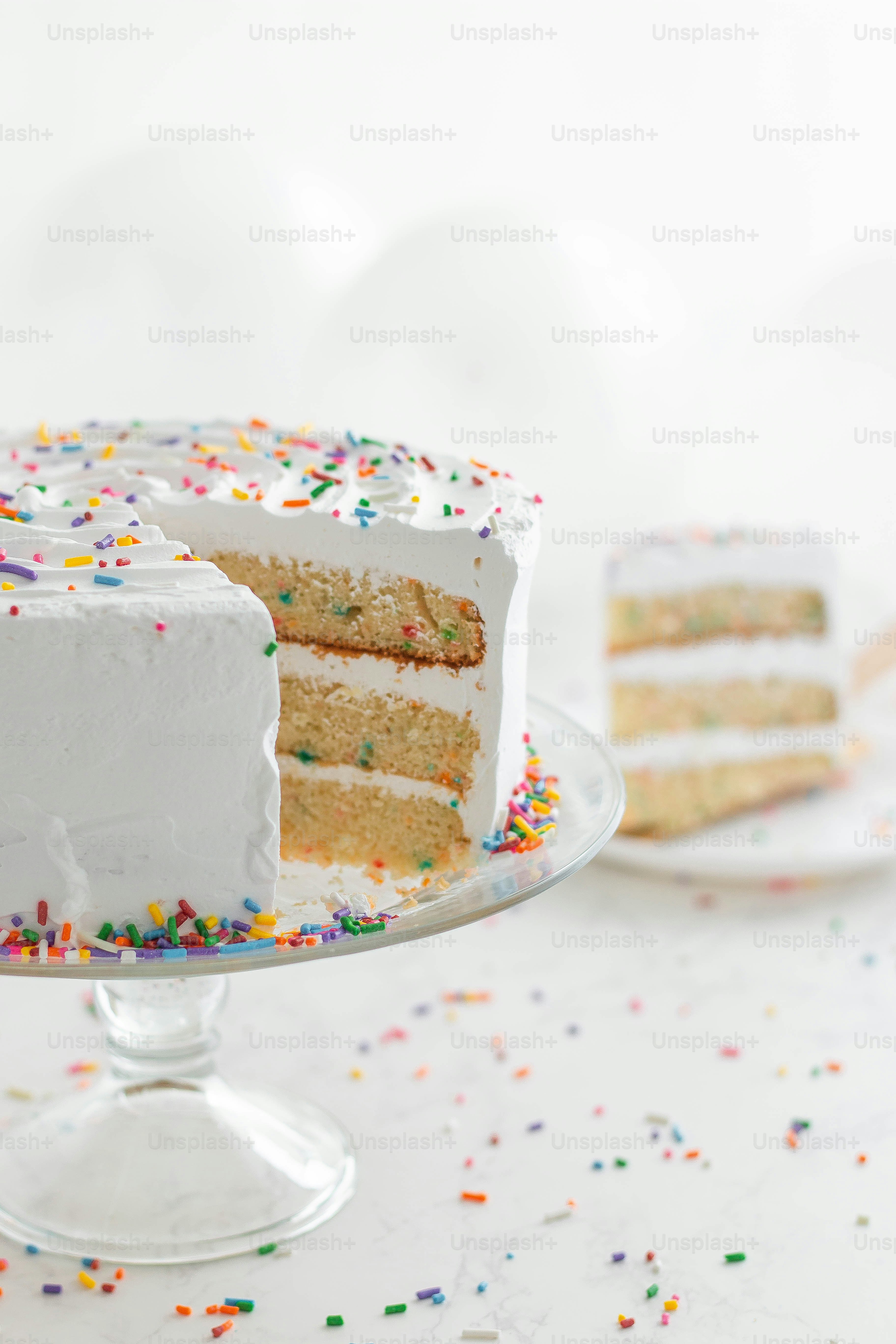 A white cake with white frosting and sprinkles photo – Birthday Image ...