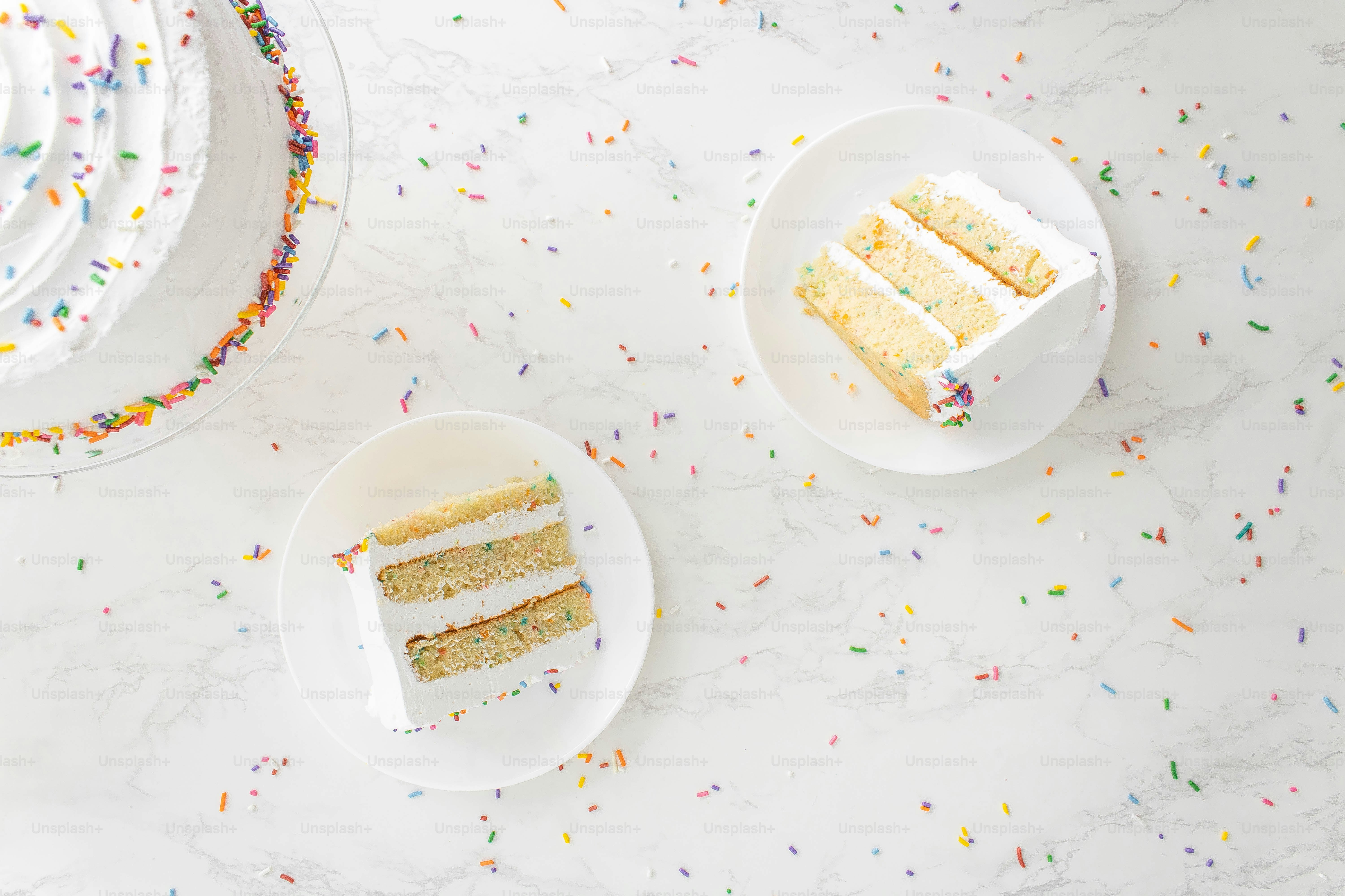 A white plate topped with two slices of cake photo Dessert Image on