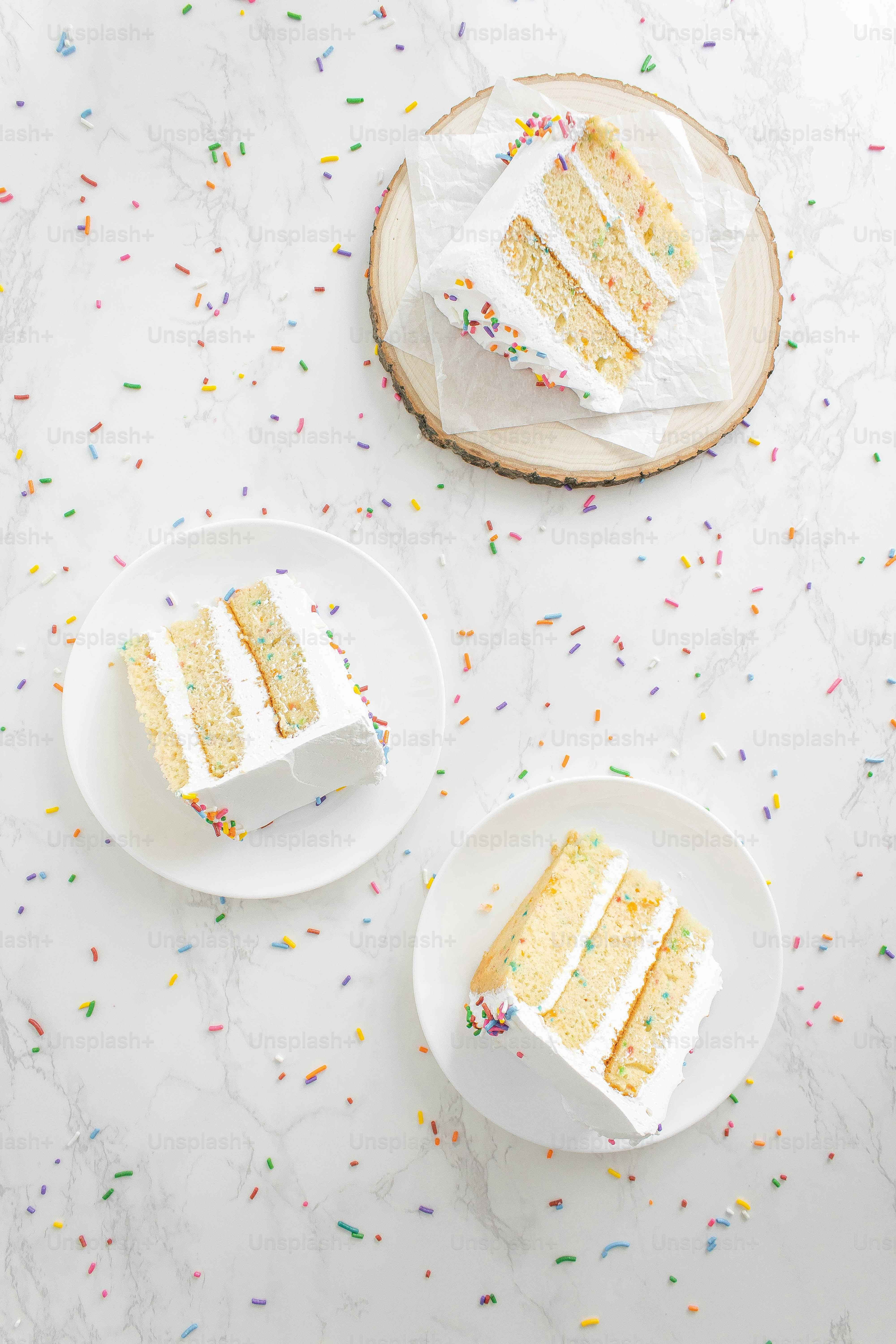 two slices of cake on plates on a table