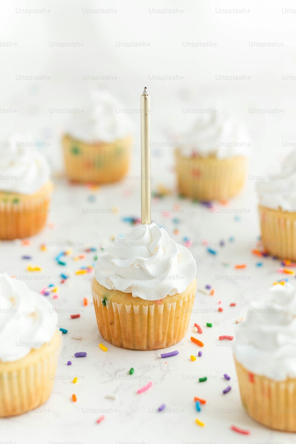a cupcake with a candle sticking out of it