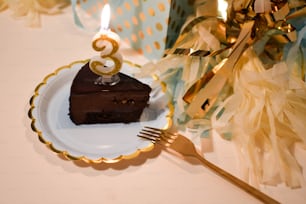 a piece of chocolate cake on a plate with a fork
