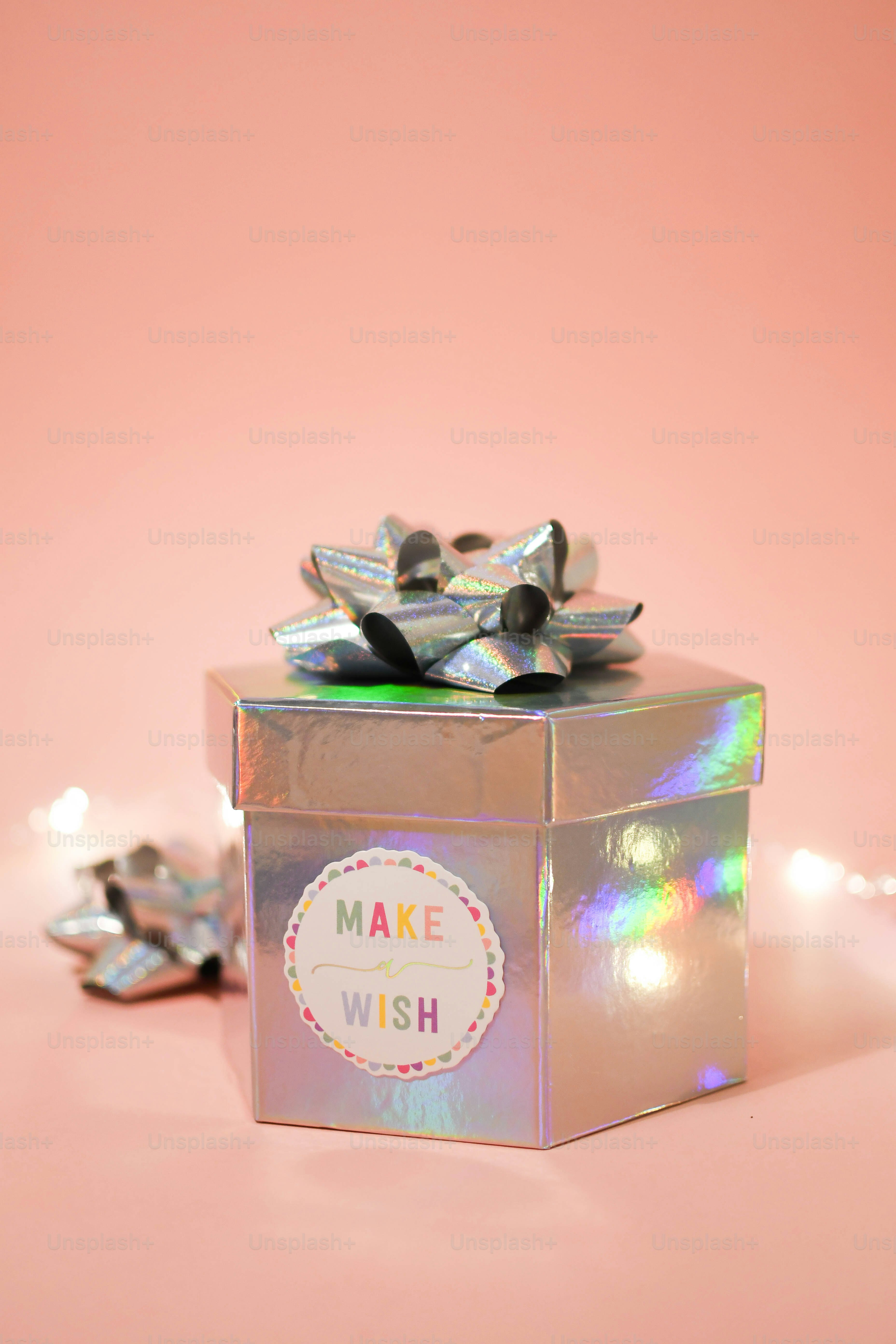 a small box with a bow on top of it