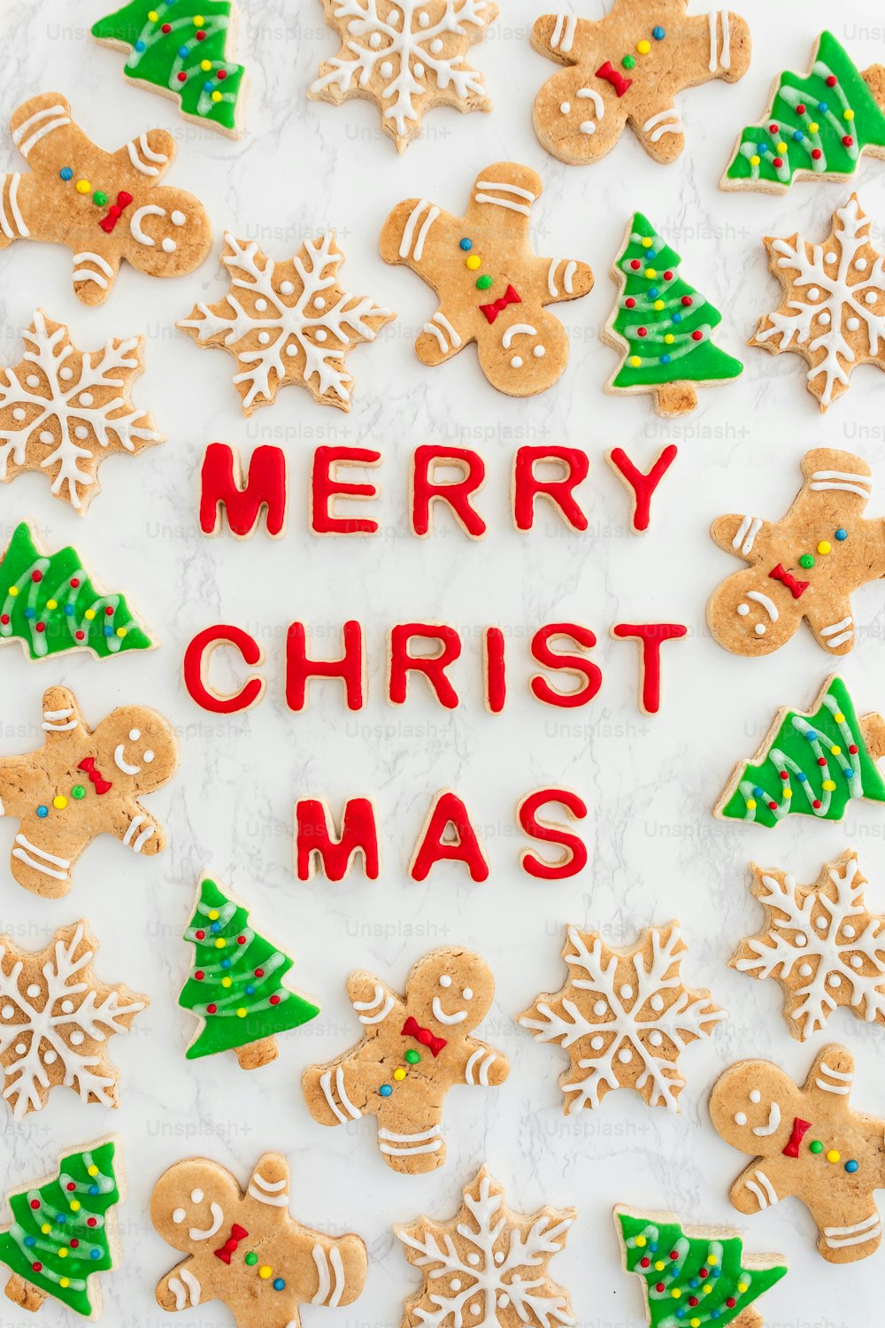 a merry christmas message surrounded by decorated cookies