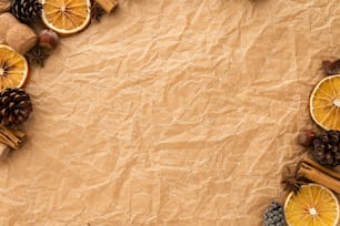 a piece of paper with orange slices and pine cones