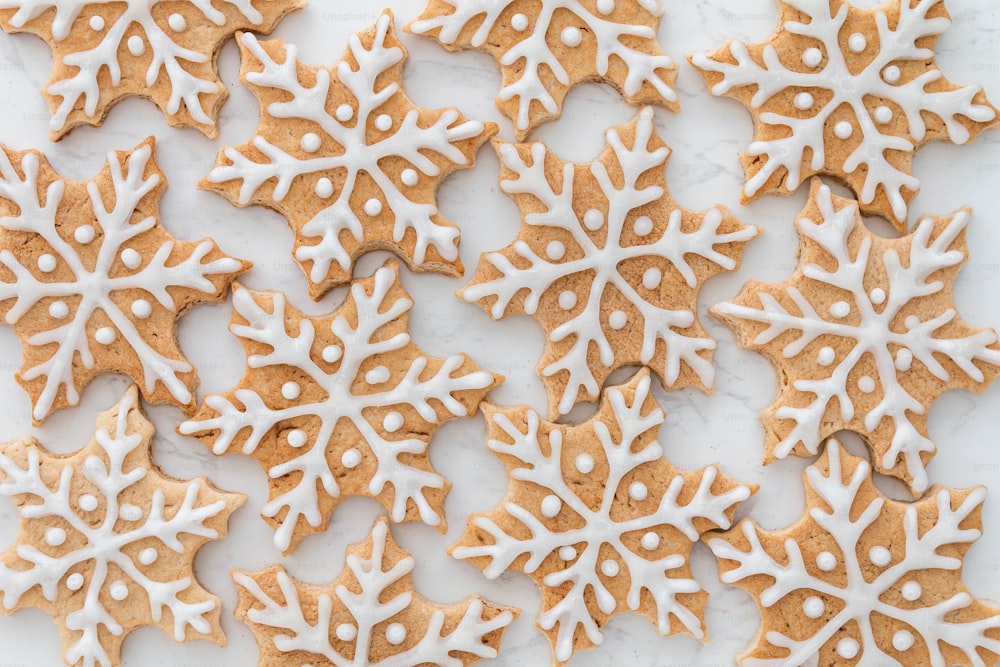 a bunch of snowflake cookies on a table