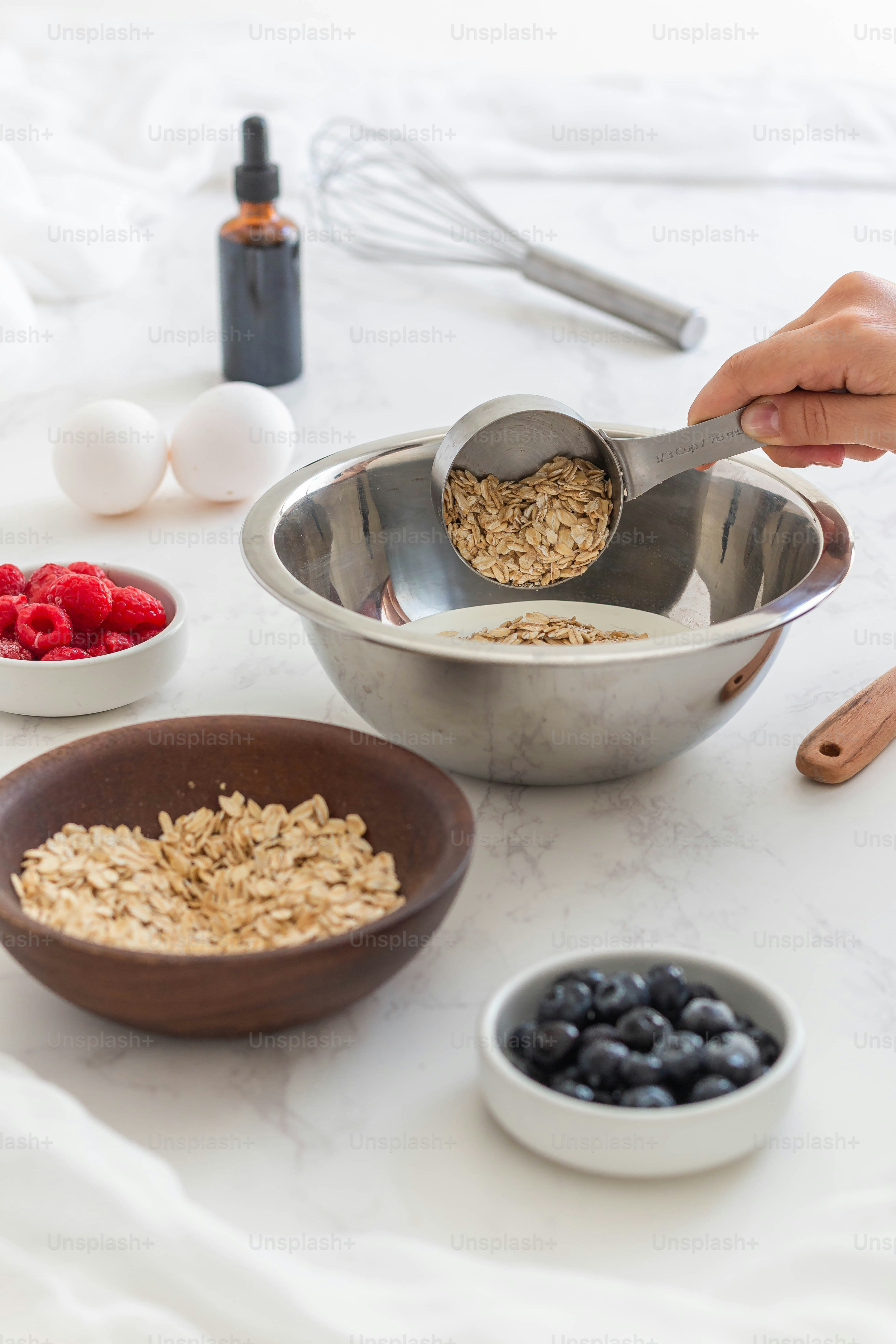 a person scooping oatmeal into a bowl