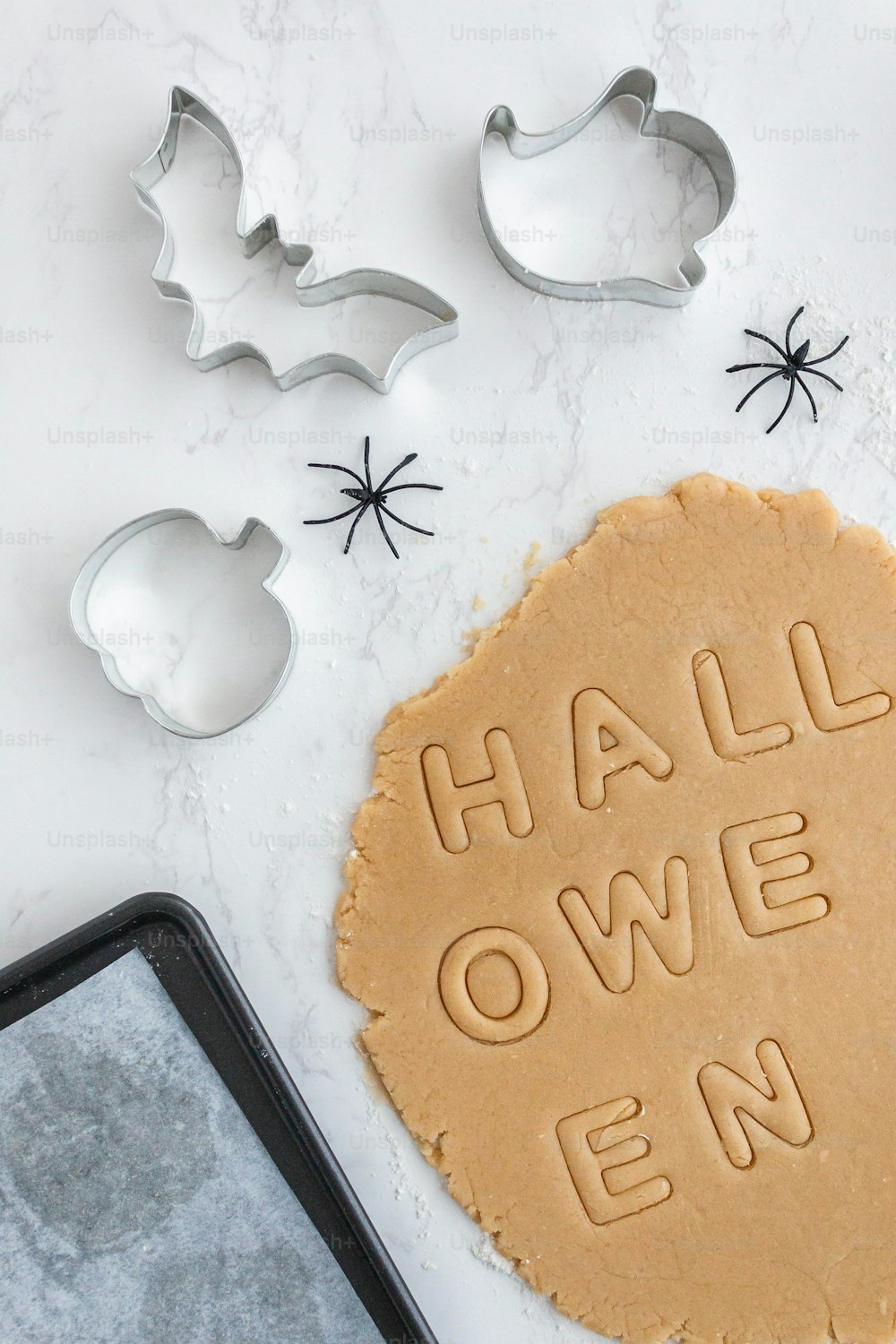 a cookie with the words halloween spelled on it