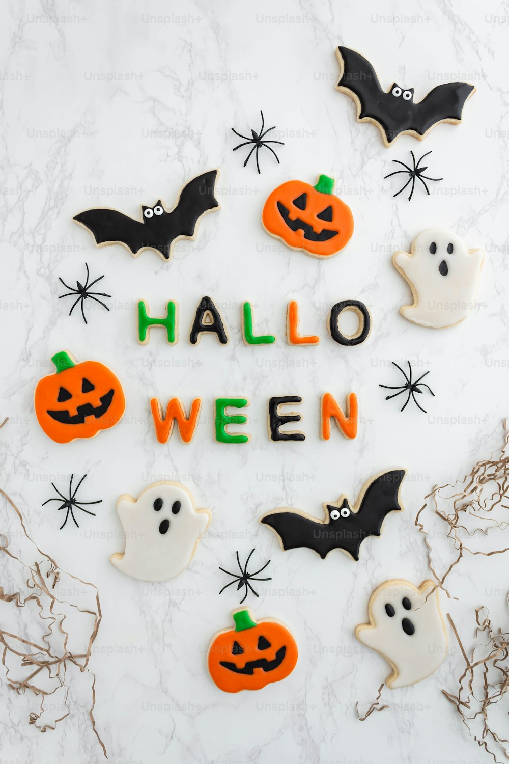 decorated halloween cookies arranged in the shape of a wreath