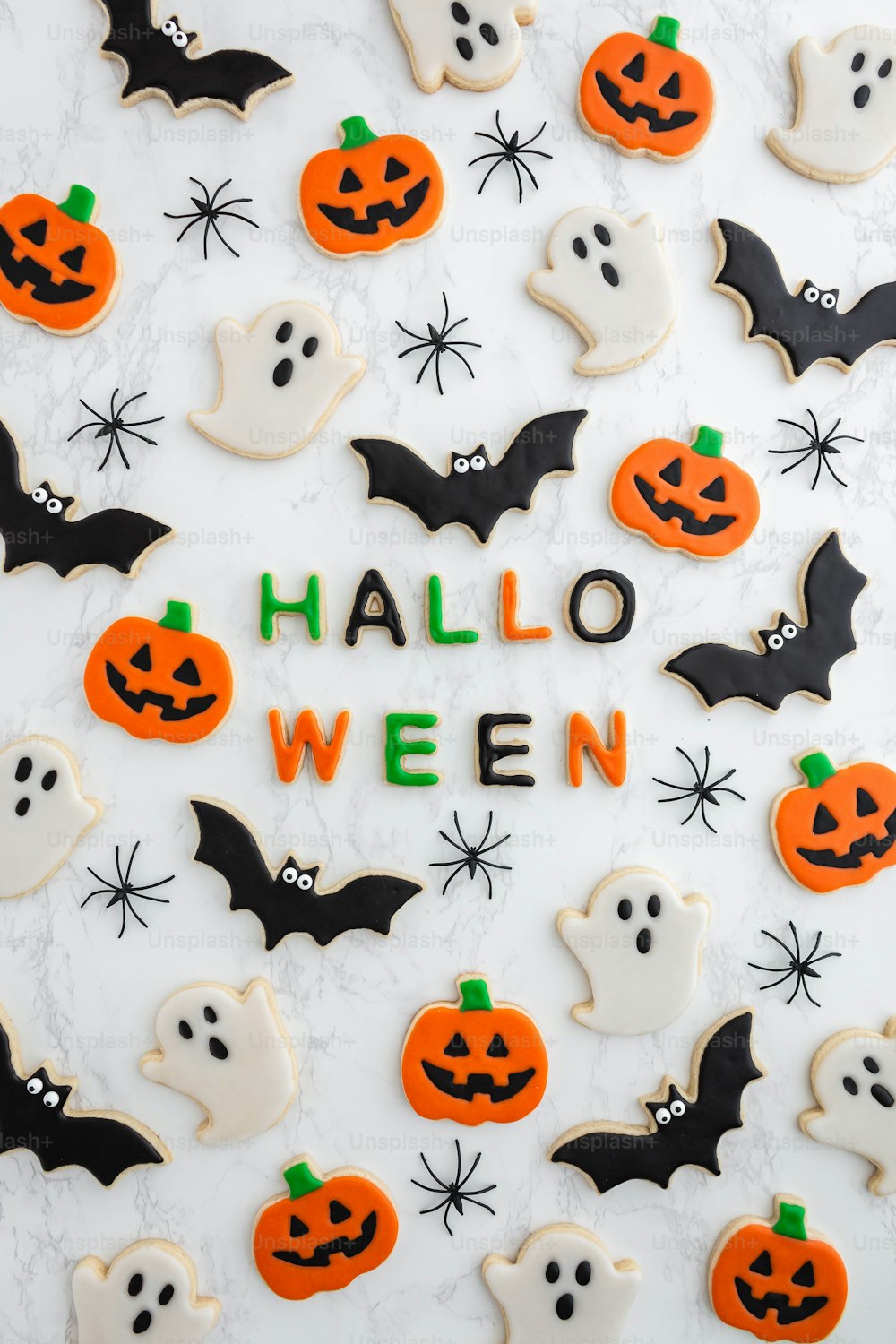 decorated halloween cookies with the words halloween on them
