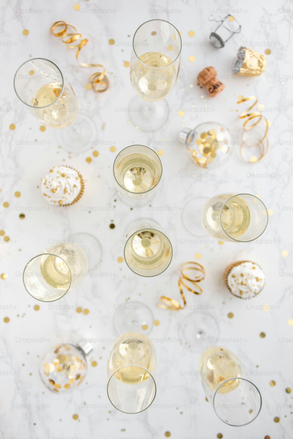 a table topped with wine glasses filled with champagne