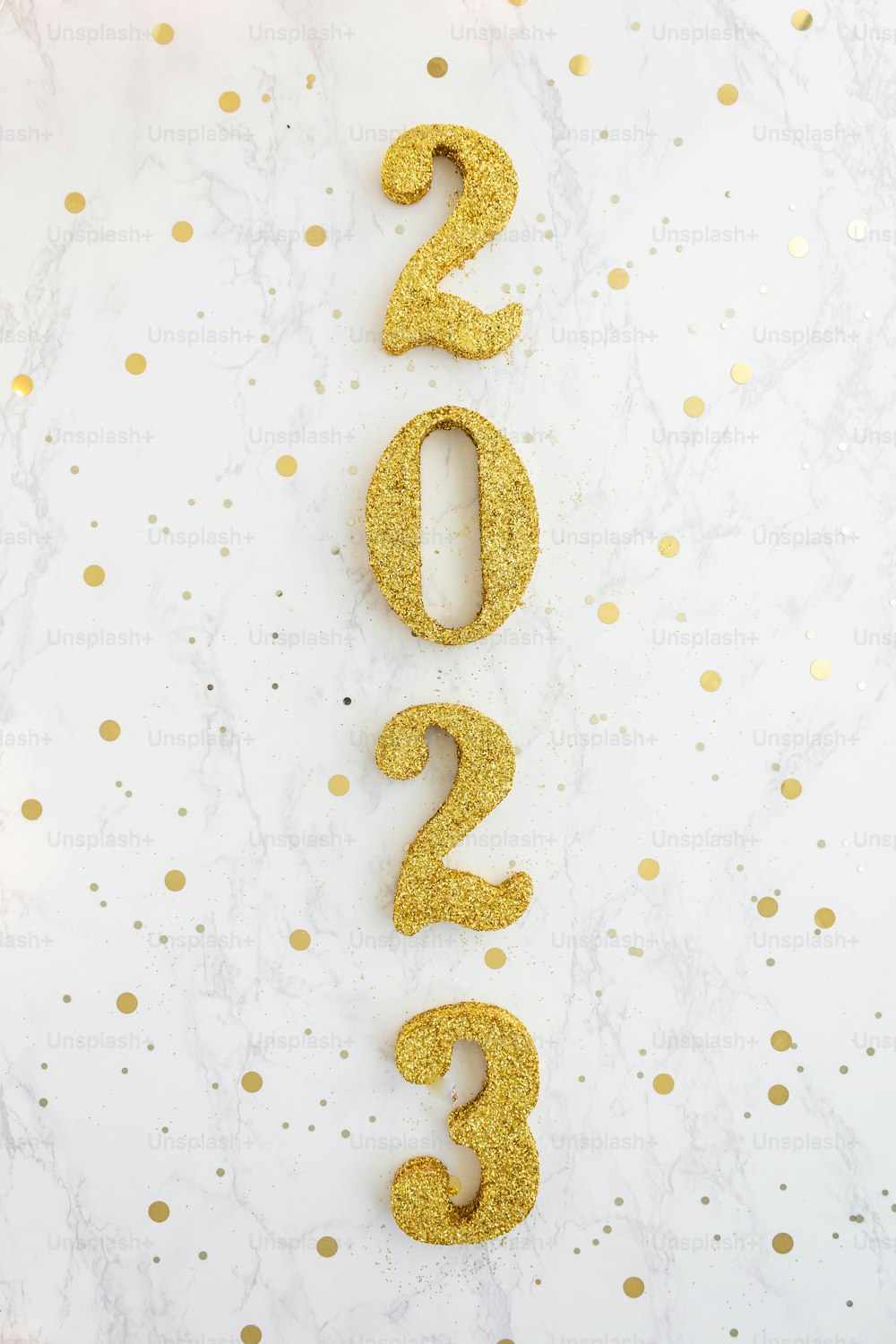 the numbers are spelled out in gold glitter