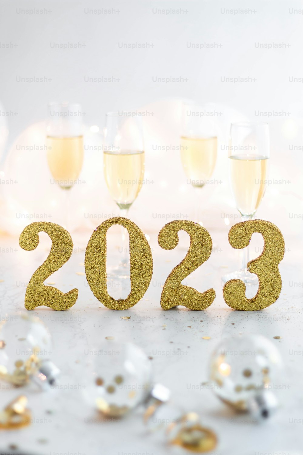 a table topped with champagne glasses filled with champagne