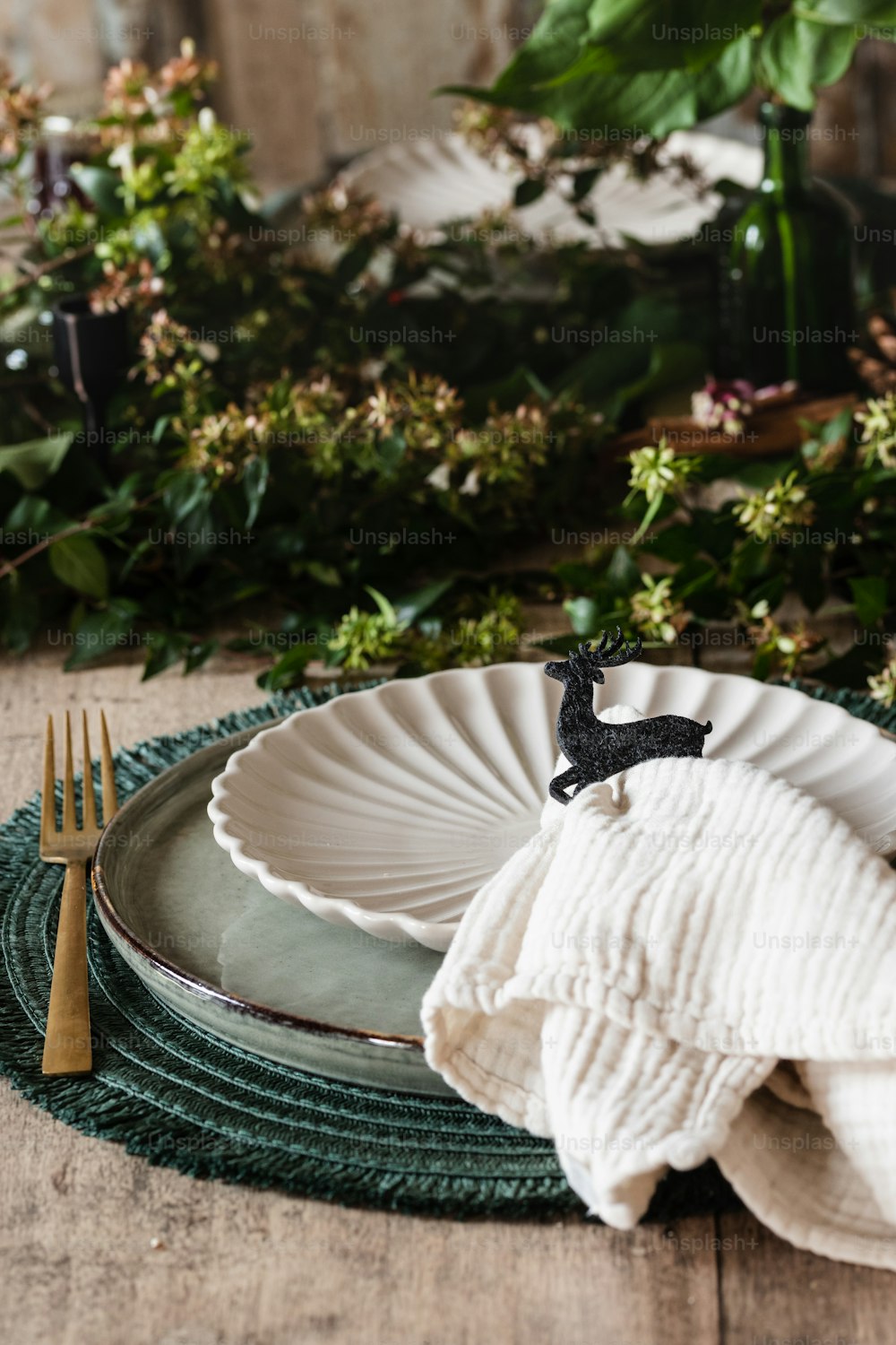 a plate with a napkin and a fork on it