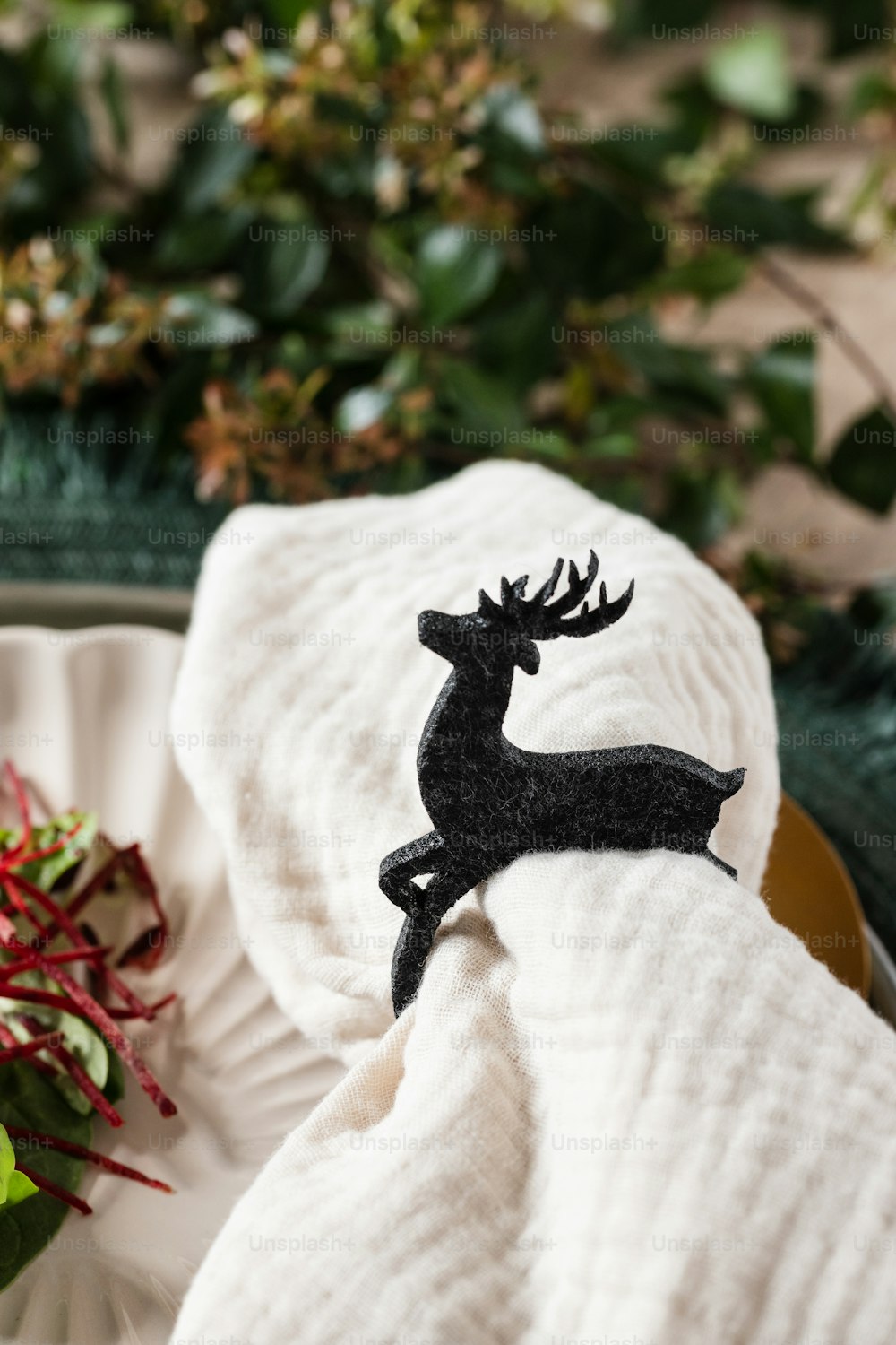 a deer figurine sitting on top of a white towel