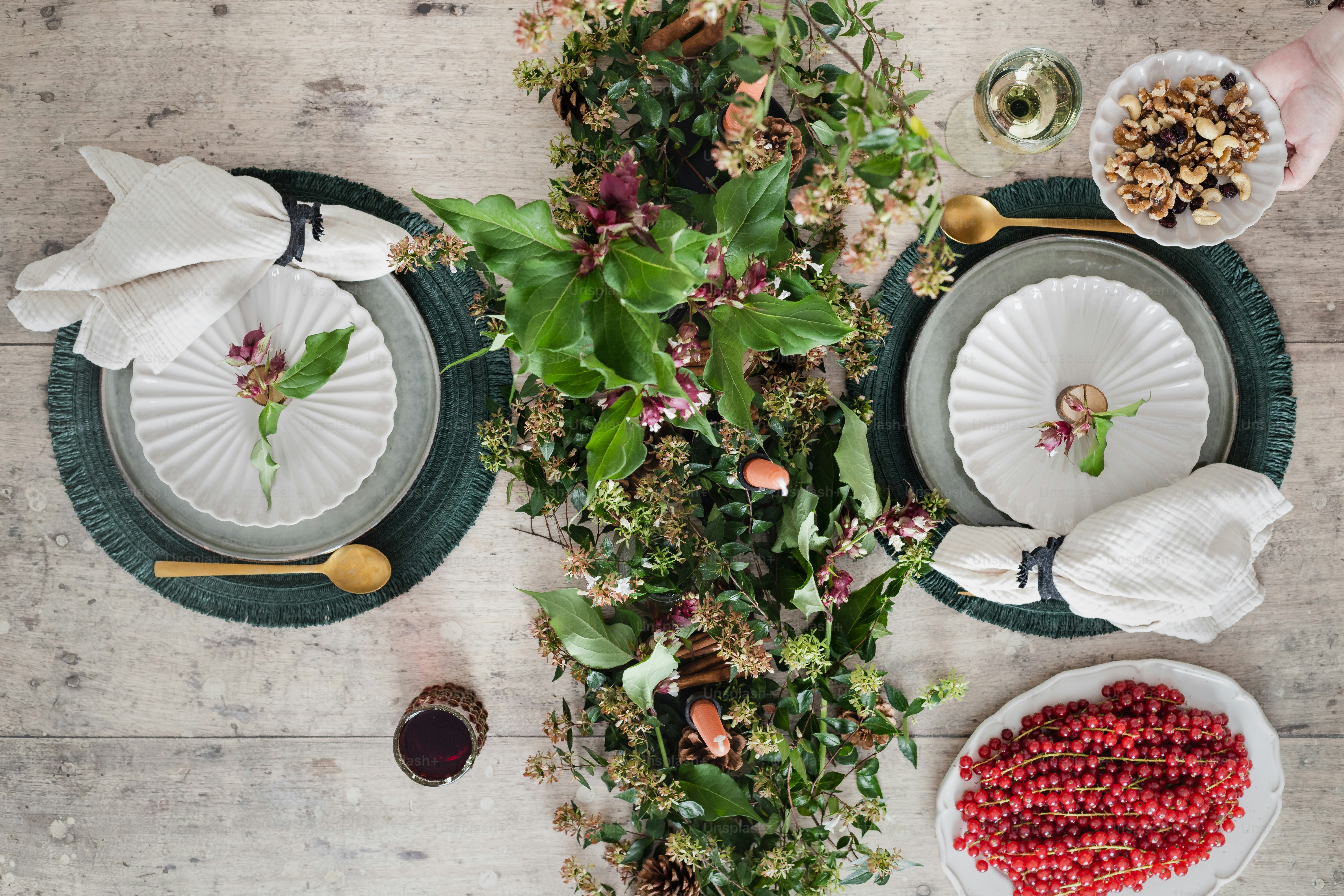 a table topped with plates and bowls filled with food