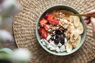 a bowl of oatmeal with fruit and nuts