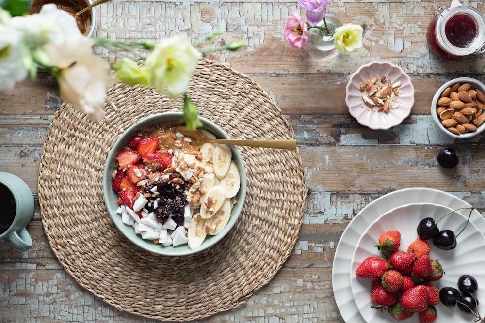 a bowl of fruit and yogurt on a table