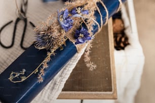 a close up of a blue ribbon on a table