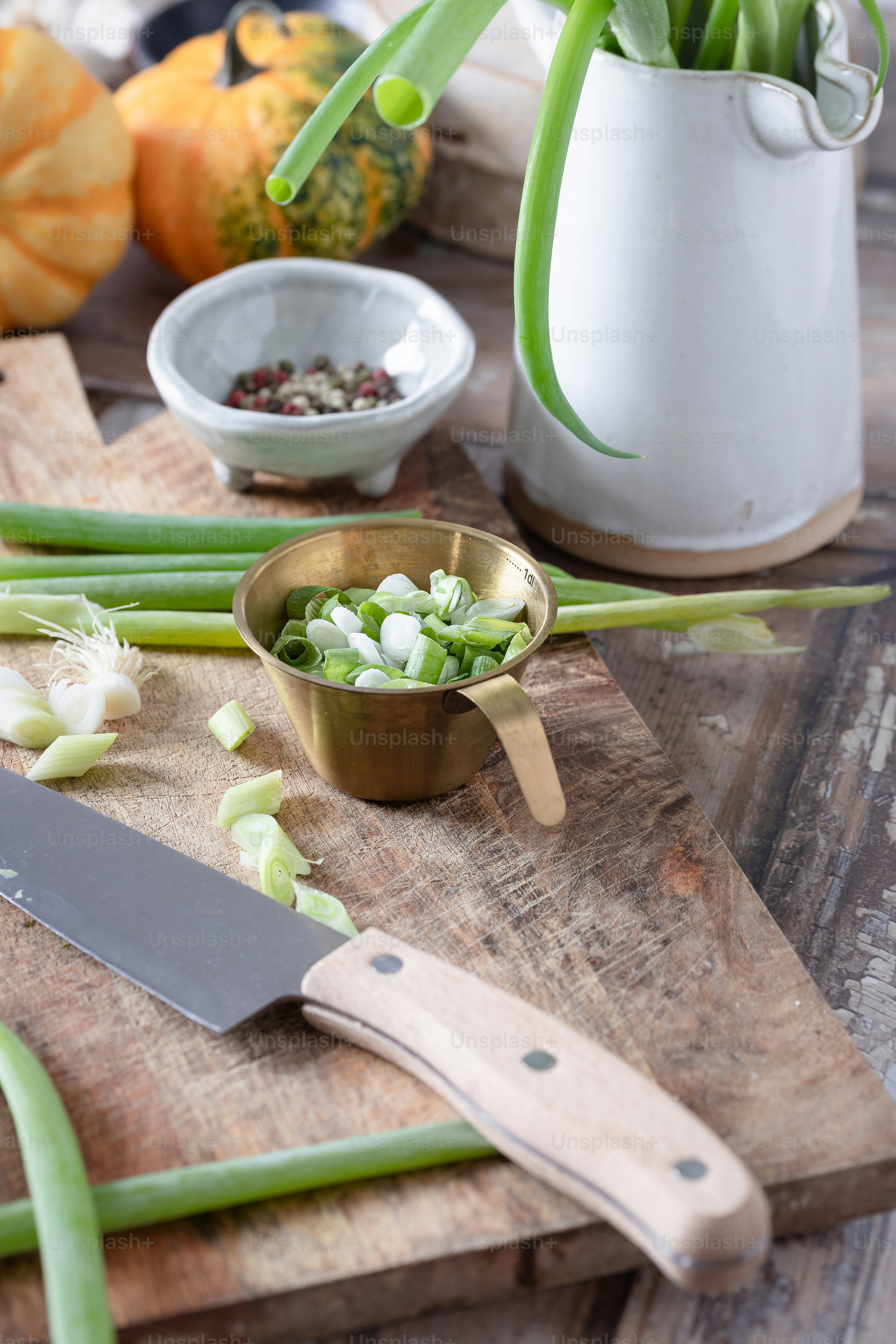 A wooden cutting board topped with green onions photo – Thanks giving ...