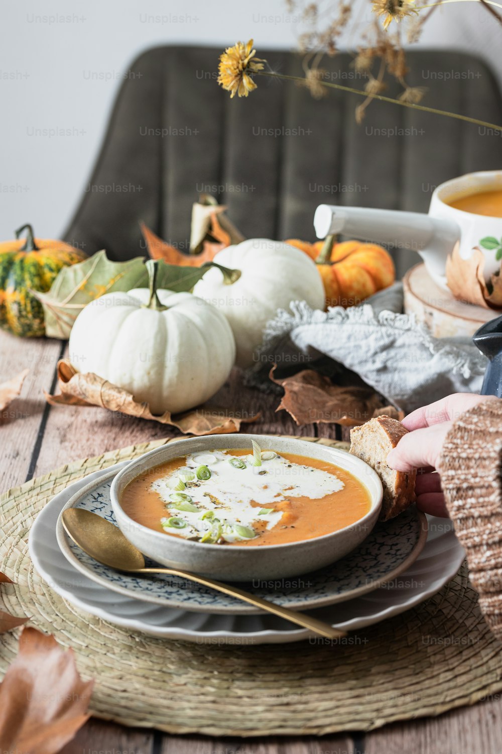 a bowl of pumpkin soup on a table