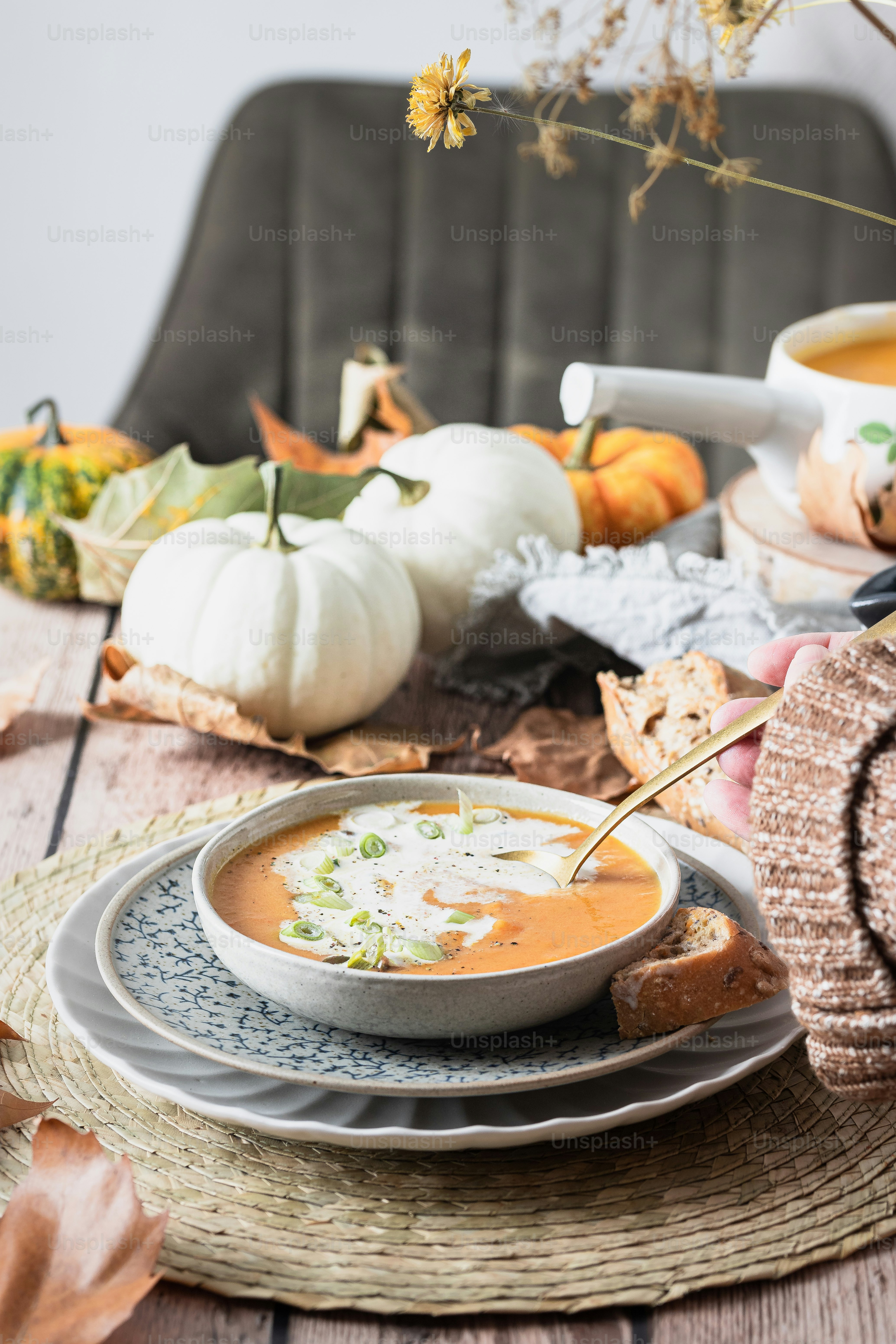 a bowl of soup sitting on top of a plate