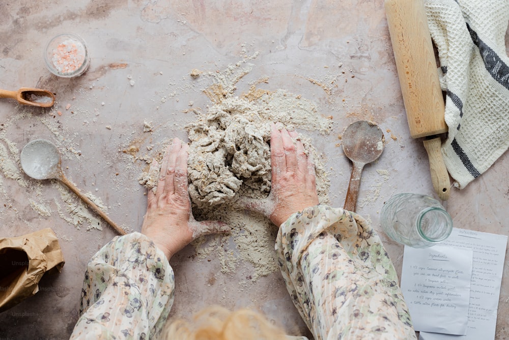 a person with their hands in a pile of dirt