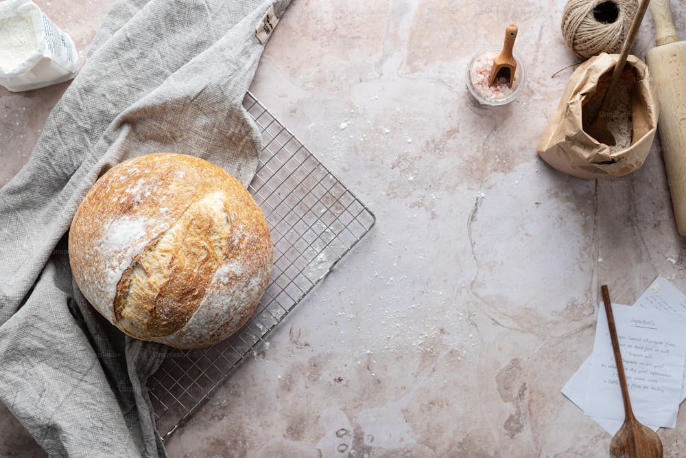 a loaf of bread sitting on top of a cooling rack