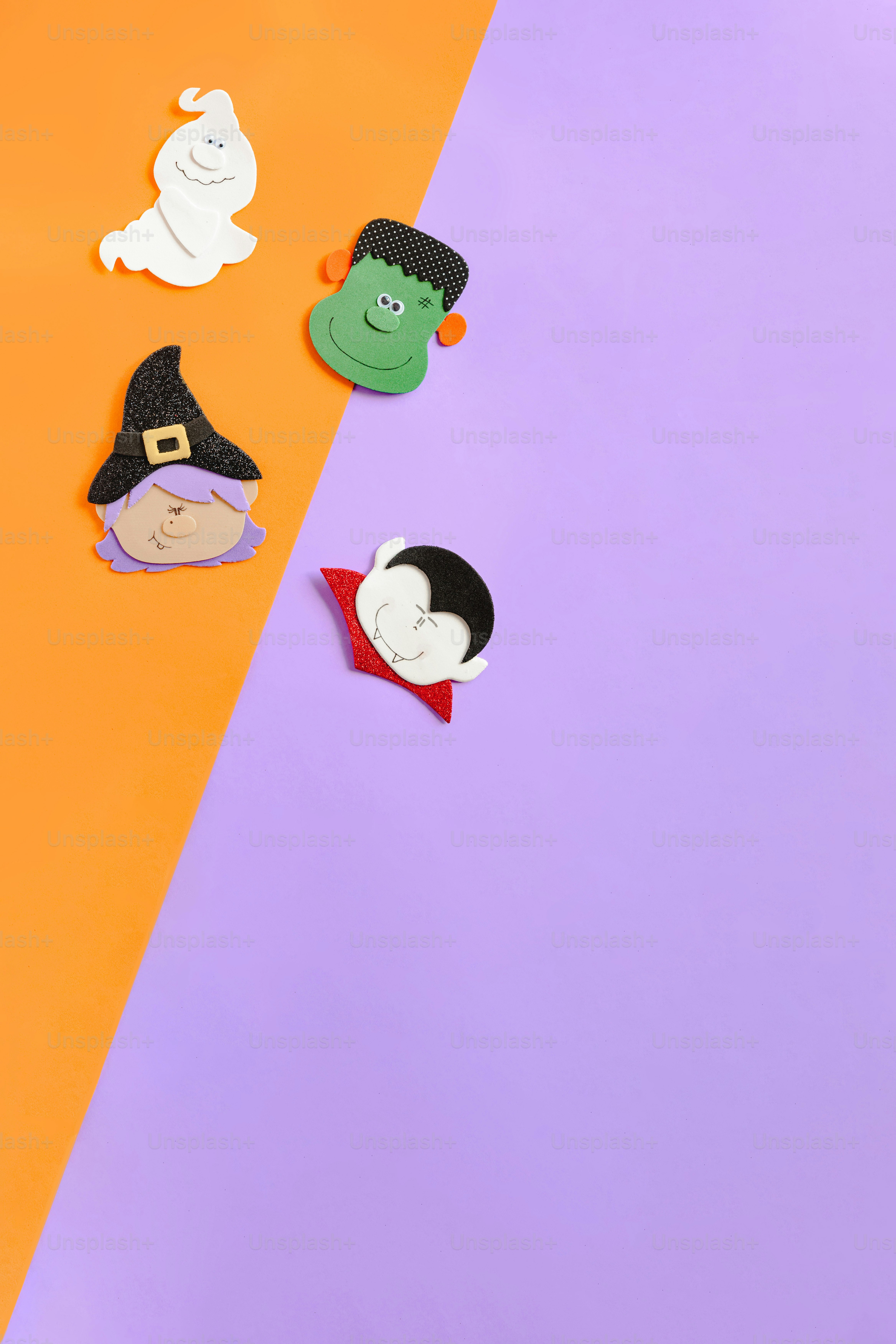 A group of paper cut out of the shape of halloween characters photo