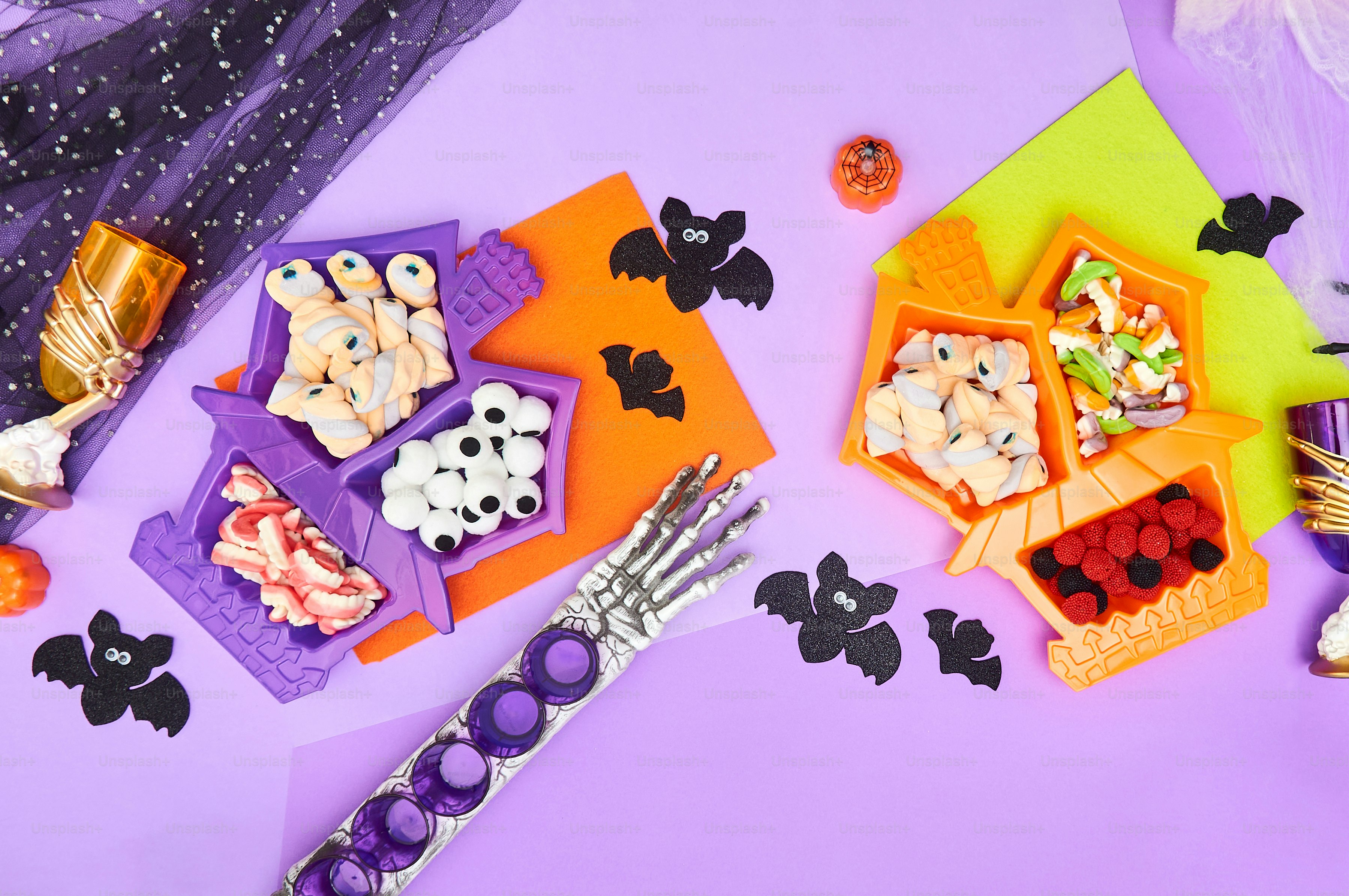 a table topped with lots of halloween treats