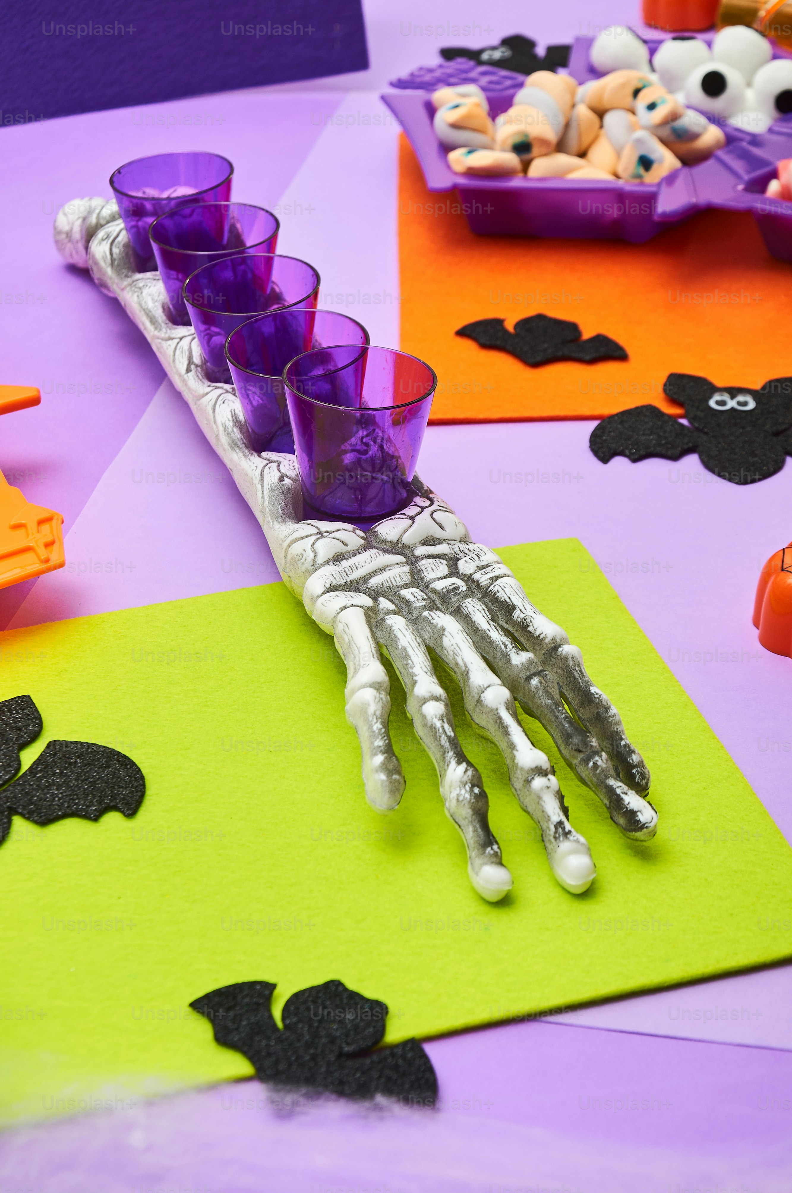 a table topped with halloween decorations and candles