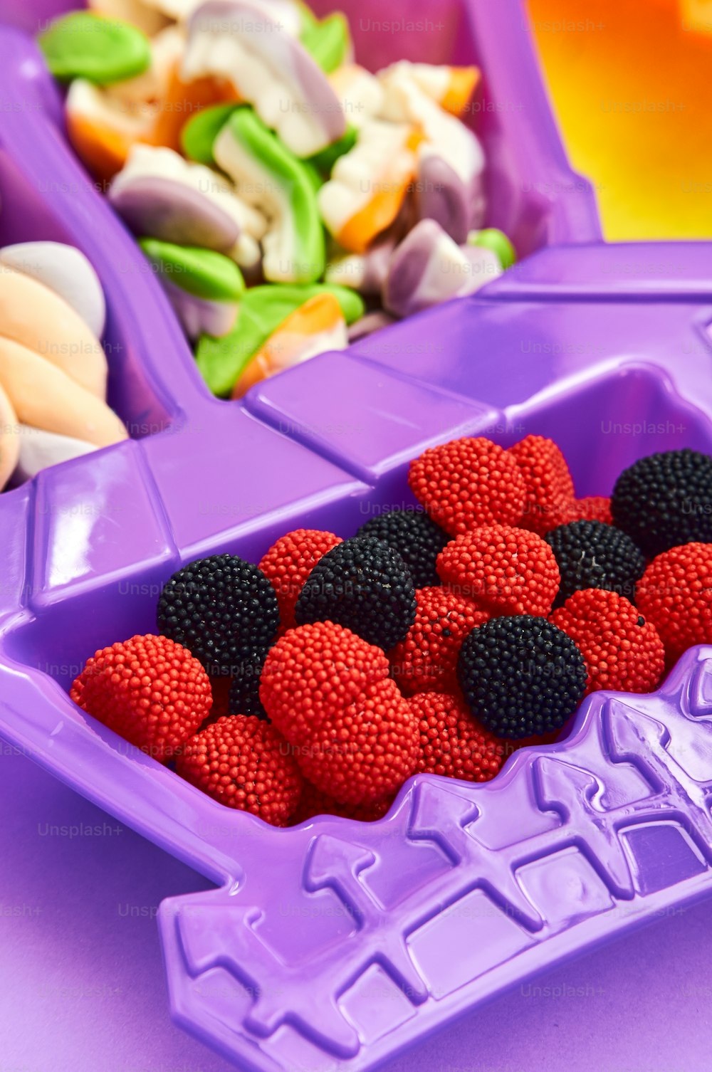 a purple container filled with lots of fruit
