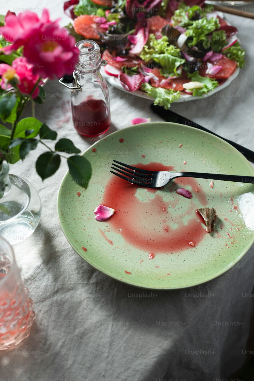 a plate with a knife and fork on a table