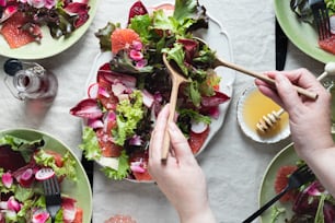 a table topped with lots of plates of food