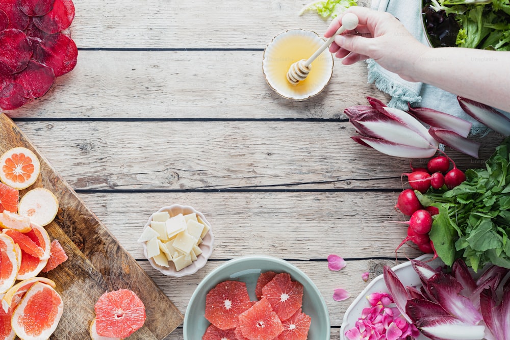 a wooden table topped with sliced up grapefruits