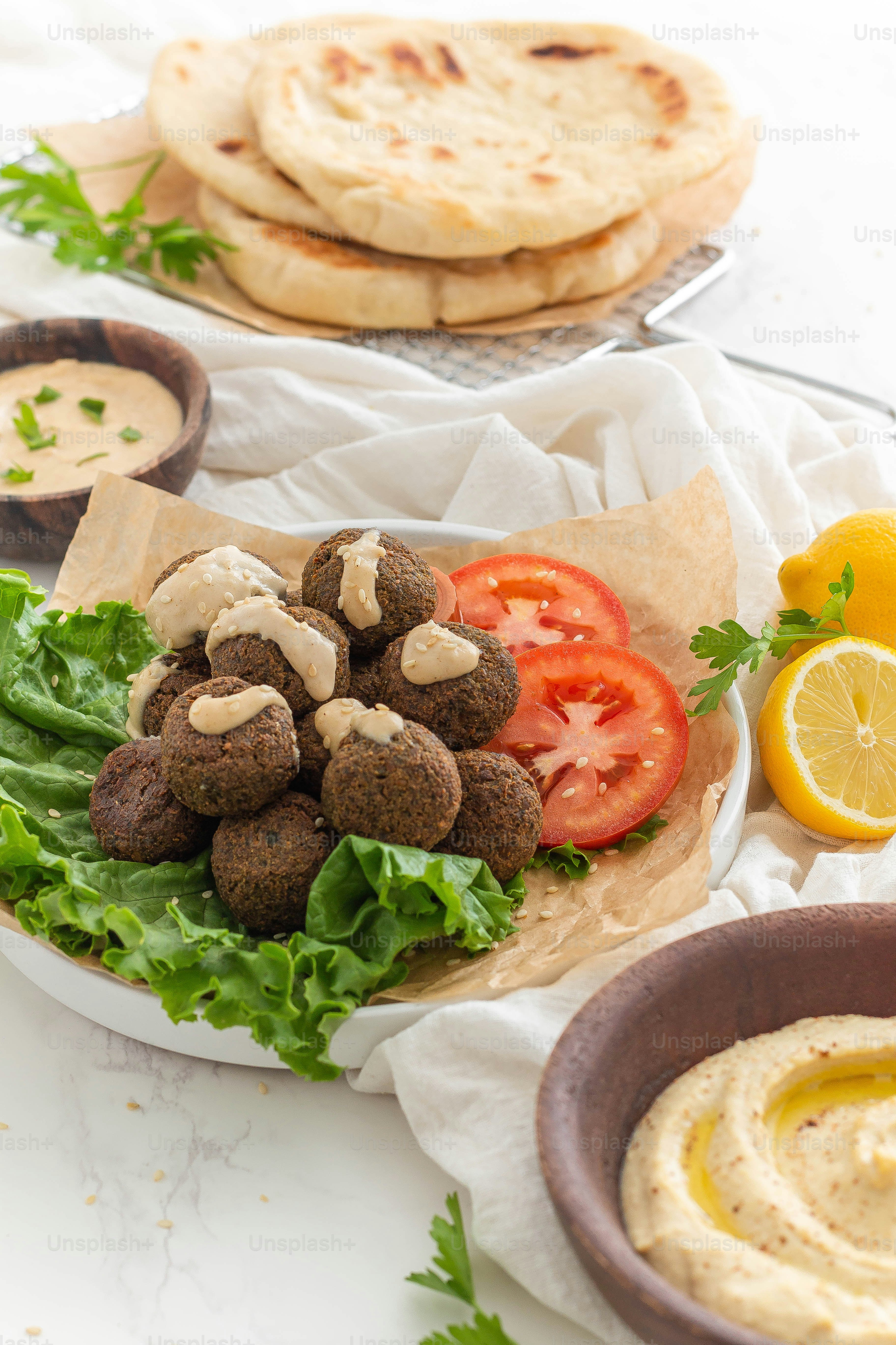 a plate of pita bread, pita salad, and pita bread with