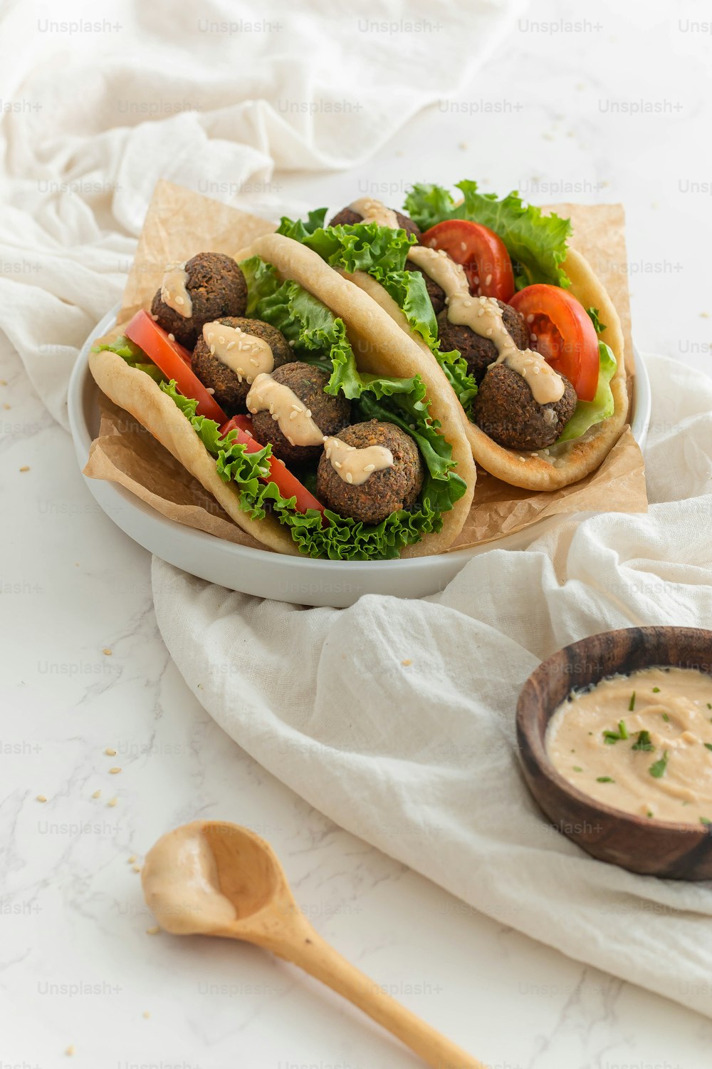 a couple of tacos sitting on top of a white plate