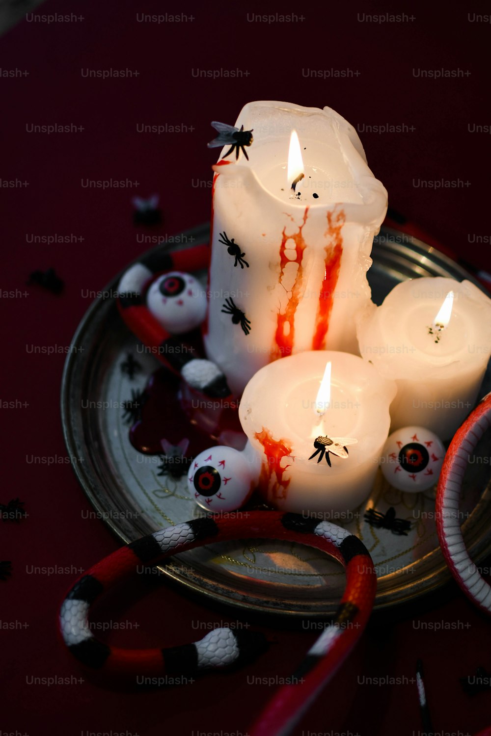 a group of candles sitting on top of a plate