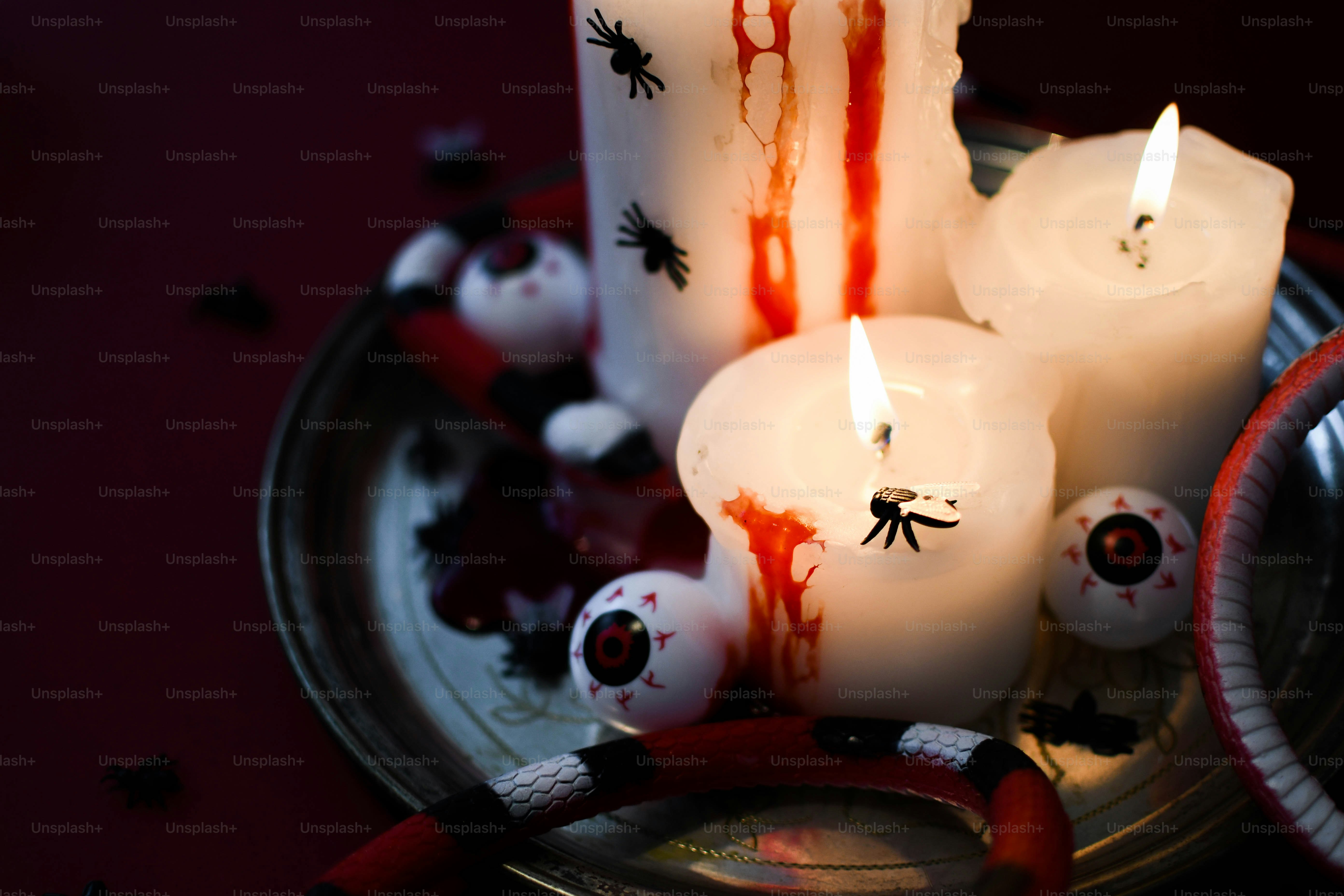 a group of candles that are sitting on a plate