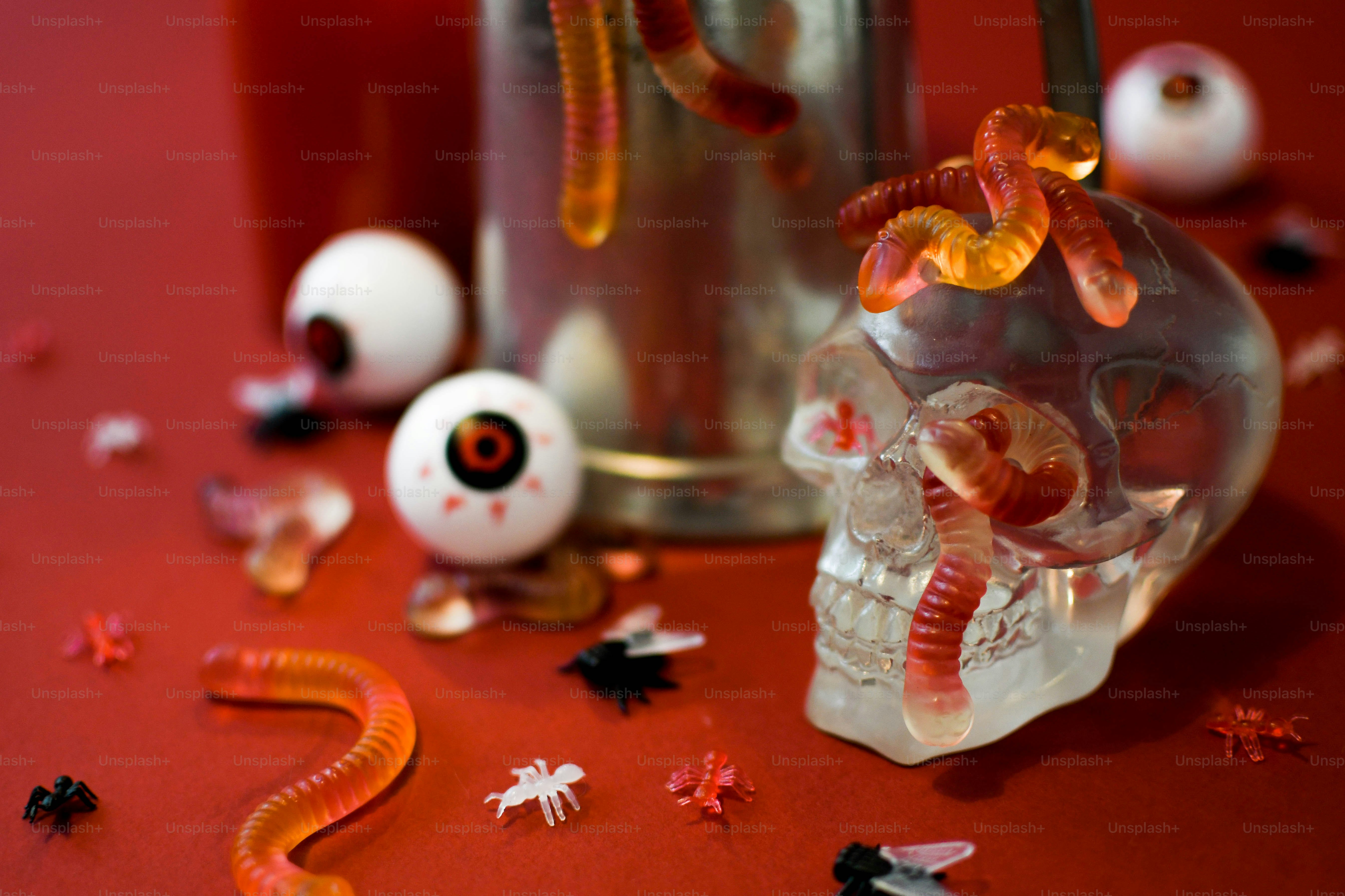 a glass skull with a worm on top of it